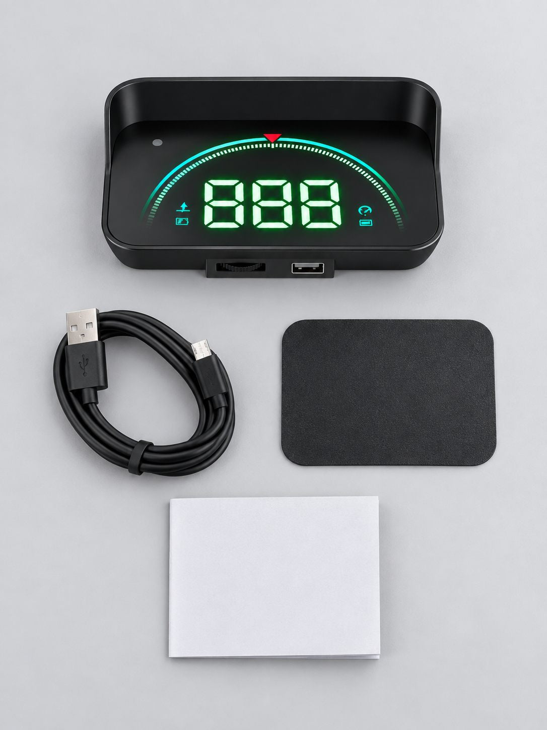 Qué trae: el dispositivo, el cable USB, la base y el manual
